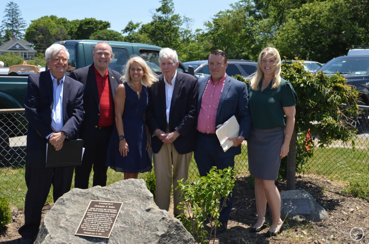 Former Islip deputy supervisor Chris Bodkin (fourth from left) stands before the memorial dedicated to his efforts in preserving Cherry Avenue property for soccer fields. With him are (left to right) friend Tommy Travis, councilmembers Jim O’Connor and Mary Kate Mullen, Bodkin, James Bertsch and NYS Sen. Alexis Weik.